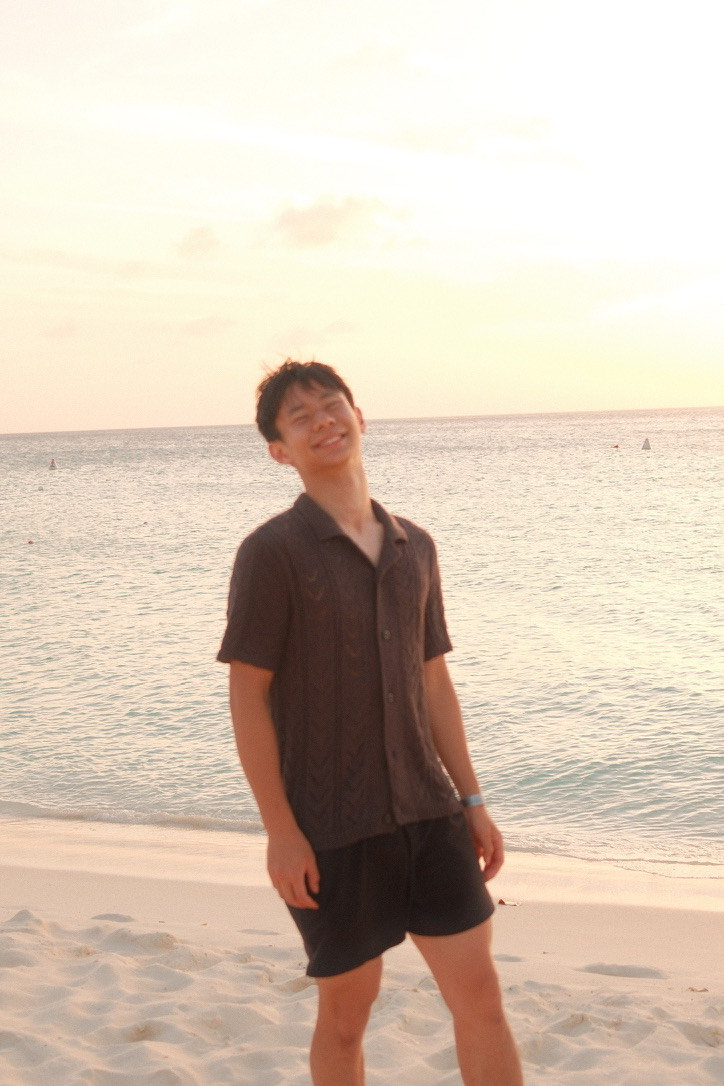 matthew on a beach at sunset